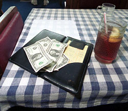 A 'tip' for food servers: Encourage separate checks at large tables to get a bigger tip.