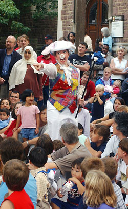 A huge crowd enjoys the antics of the White Rabbit (Tarah Demant, a graduate student in English in Arts & Sciences) during The Mad Hatter's Tea Party at the 150th Birthday Party Sept. 14.
