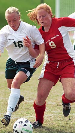 WUSTL midfielder Sara Schroeder (16) battles for possession in action against Carnegie Mellon University earlier this month. The Bears will close their regular season home schedule this weekend with a 7:30 p.m. game today vs. the University of Rochester and a 1:30 p.m. contest Nov. 2 against Case Western Reserve University.