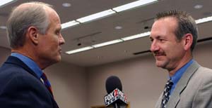 KTVI reporter Tom O'Neal (left) interviews GSC Director Richard K. Wilson about the research units at the BioMed 21 news conference.