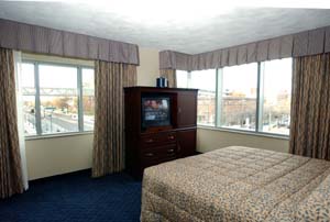 A spacious king suite showcases a view of the Central West End.