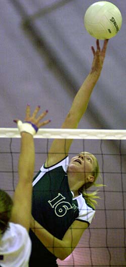 Senior Amy brand skies high to play a ball during the Bears' NCAA Tournament title match Dec. 6 against New York University at the University of La Vern in California.