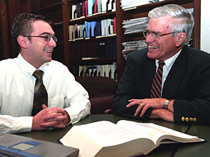 Charles R. McManis, J.D. (right), the Thomas and Karole Green Professor of Law, discusses international intellectual property law with first-year student Jeremy Zangara. McManis