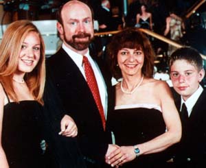 Cross with daughter, Courtney; husband, DeWitte; and son, Kevin.