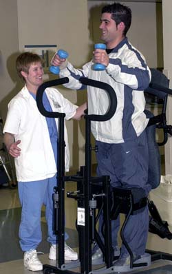 Pioneering research by spinal cord injury specialists in the School of Medicine offers patients like Oscar Segovia the most progressive treatment available. Here, Segovia works with physical therapist Cassandra Pate at the Rehabilitation Institute of St. Louis.