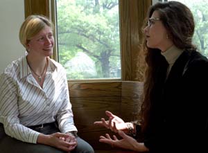 Krista Thomas (left) of the George Warren Brown School of Social Work talks with close friend Heliana Ramirez, her co-chair of the Student Coordinating Council at GWB. Tonya Edmond, Ph.D., assistant professor of social work, says Thomas 