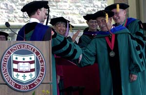 Chancellor Mark S. Wrighton, left, congratulates Lee M. Liberman, chairman emeritus of Laclede Gas Company and life trustee at Washington University, as he receives a doctor of philosophy in interdisciplinary studies from the Graduate School of Arts & Sciences. At 82, (he'll be 83 in July) Liberman is the oldest person to receive an academic degree at this year's graduation. (It is believed that he is the oldest person to receive a doctorate from the university.)