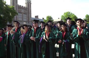 The Class of 2004 is the first to wear the university's new green Commencement gowns. The gowns, which have black velvet trim and the university shield on both shoulders, were designed in honor of the university's Sesquicentennial.