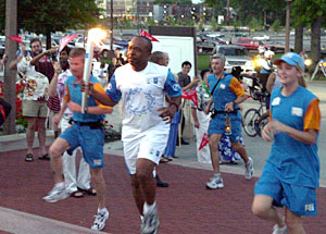 Michael R. DeBaun, M.D., associate professor of pediatrics and of biostatistics at the Washington University School of Medicine, runs up the steps of Brookings Hall.