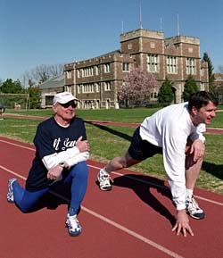 Edwin D. Wolfgram, M.D. (left), assistant clinical professor of psychiatry in the School of Medicine, trains at Francis Field with Michael D. Moll, vice dean for business affairs in the School of Engineering & Applied Science. 