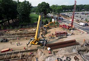 MetroLink construction at Skinker Boulevard and Forest Park Parkway — as seen above, looking south from the roof of the 276 N. Skinker Building — has continued this summer, as it has at numerous other St. Louis-area sites. Already served by a MetroLink station at the Medical Campus, the University will further benefit from three new stations: at Skinker and the parkway; at Big Bend Boulevard and the parkway; and at West Campus, at the parkway and Forsyth Boulevard.