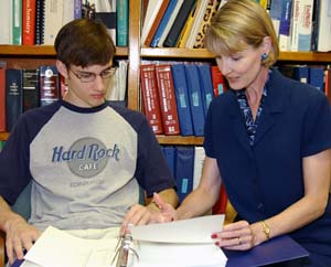 Linda J. Pike, Ph.D., works with student Evan Sadler on his summer research project. As chair of the Faculty Senate and the Faculty Senate Council, Pike represents the faculty on the University Council and the University Management Team.