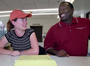 T.J. Shelton and student worker Rebecca Castellon discuss events at the Athletic Complex. 