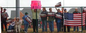 Bush supportors line the fence at the north side of the public viewing area. Overall, demonstrators were peaceful in their approach, and there were no major incidents.
