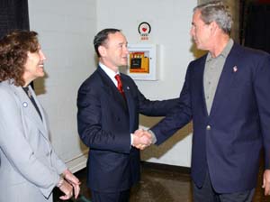 Chancellor Mark S. Wrighton and his wife, Risa Zwerling Wrighton, greet President George W. Bush upon his arrival Oct. 8 at the Athletic Complex.