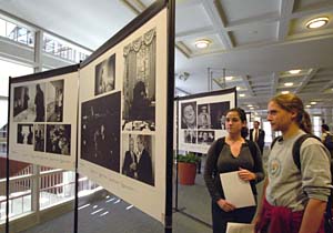 Freshmen Maia Elkana (left) and Miriam Wiegand examine the exhibit The Presidential Image: 60 Years of the Best in White House Photography in Olin Library. Sponsored by MSNBC, Fujifilm and National Geographic, the exhibit was staged at this year's three presidential debate sites.