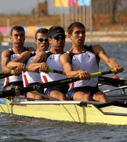 Student Steve Warner (front) and his rowing team compete in the 2004 Olympic Games. The crew finished ninth in the second finals race after a week-long regatta.