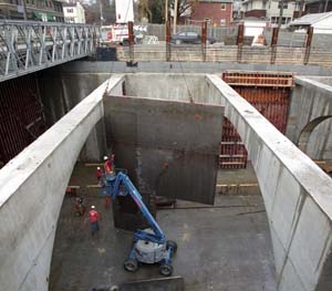 As viewed looking north, at Forest Park Parkway just east of Big Bend Boulevard, construction crews work on a new MetroLink station. Metro is anticipating that the cross-county expansion project will be finished in mid-2006.