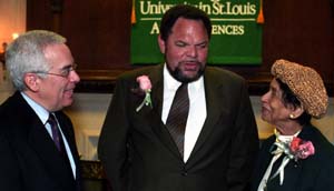 John Baugh, Ph.D. (center), has been named director of African and Afro-American Studies in Arts & Sciences and will hold an Arts & Sciences endowed professorship named in honor of civil rights attorney and emerita trustee Margaret Bush Wilson (right). Chatting with them at a welcoming reception is Edward S. Macias, Ph.D., executive vice chancellor, dean of Arts & Sciences and the Barbara and David Thomas Distinguished Professor in Arts & Sciences.