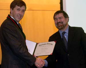 Christopher I. Byrnes, Ph.D. (right), dean of the School of Engineering & Applied Science and the Edward H. and Florence G. Skinner Professor of Systems Science and Mathematics, congratulates Joseph A. O'Sullivan, Ph.D., at his Dec. 13 installation as the Samuel C. Sachs Professor of Electrical Engineering.