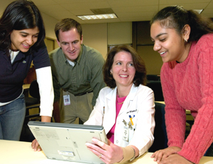 (From left) Medical students Anjali Gopalan, Steven Sperry and Noopur Gangopadhyay discuss a recent lecture on cancer genetics with Alison J. Whelan, M.D., associate dean for medical student education. Whelan says she loves working with students because 