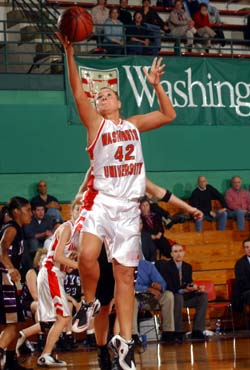 Alicia Herald drives to the hoop for two points against New York University in recent action. Herald leads the Bears with a .646 shooting percentage and has pulled down a team-high 133 rebounds in helping the Bears to a 20-4 mark.