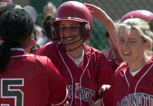 Bears junior Monica Hanono is congratulated by her teammates after hitting a home run against Millikin April 2. WUSTL is now 27-1 and ranked No. 2 in Division III.