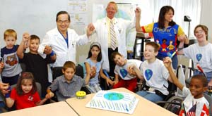 T.S. Park, M.D. (left), earns international acclaim for his groundbreaking cerebral palsy research, particularly for refining surgical procedures for spastic cerebral palsy — a procedure he has performed on more than 1,300 patients from 47 states and 30 countries. Here he hosts a party with international case manager James Lee and physical therapist Karen Good for a group of cerebral palsy patients from around the world who annually come to the medical school for extended treatment and care.