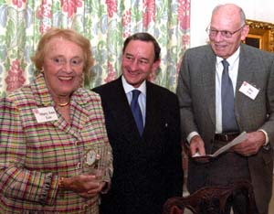 Chancellor Mark S. Wrighton is flanked by Mary Ann and E. Desmond 