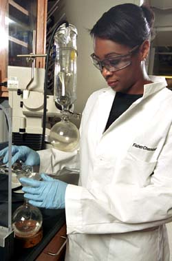 Jasmine Hunt, who majored in chemistry and in religious studies, both in Arts & Sciences, works in McMillen Laboratory.