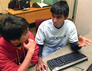 Kevin Byron (right) discusses a project with classmate Steve Lau. About four years ago, Byron won a scholarship from the government of his home country, Trinidad and Tobago, which would pay for him to attend any college in the world.