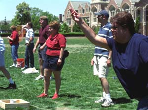 The washers tournament (above), a new event for Staff Day, proved to be a popular activity, with dozens of teams participating. The duo of Rachel Stulce and Bill Reitz took the first-place trophy.