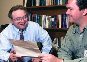 Richard D. Wetzel, Ph.D. (left), professor of psychiatry and of neurology and neurological surgery, consults with psychiatry resident Jeff Vander Kooi, M.D., about a forensic case. Wetzel spends a lot of time evaluating people involved in civil and criminal litigation, including death penalty cases. As an expert for both the prosecution and defense, Wetzel explains that he doesn't support the death penalty because 