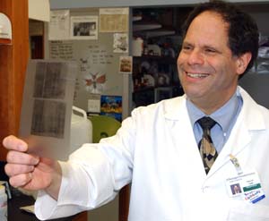 Phillip I. Tarr, M.D., head of pediatric gastroenterology and the first Melvin E. Carnahan Professor in Pediatrics, reviews a radiograph.