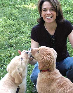 Cornelius with her golden retrievers. She loves running with her husband, Joe, and their dogs.