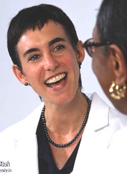 Katherine Jahnige Mathews, M.D., discusses cancer care with a patient at the Siteman Cancer Center. Mathews and Dione Farria, M.D., direct the Program for the Elimination of Cancer Disparities at Siteman.