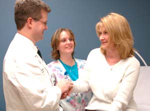 (From left) James B. Lowe III, M.D., and medical assistant Tammie Newhouse consult with patient Doris Raines about cosmetic procedures at Lowe's clinic in the Center for Advanced Medicine. 