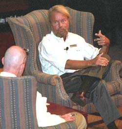 Joe Edwards, owner and developer of Delmar Loop establishments, speaks with Steve Zwolak, executive director of the University City Children's Center, at the inaugural event for the Social Entrepreneurship and Innovation Competition Sept. 8 in May Auditorium in Simon Hall.