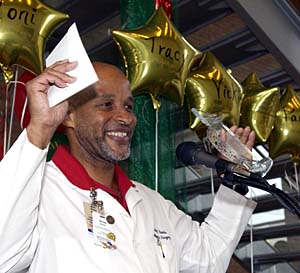 At the 2003 Clinical Employee Recognition reception, cast technician Brian Rawls of the Department of Orthopaedic Surgery celebrates winning the 2003 Guiding Star Award.