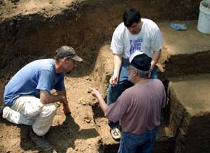 T.R. Kidder, Ph.D. (top right), professor of anthropology in Arts & Sciences, discusses the stratigraphy of Poverty Point's Mound A with Anthony Ortmann (left), a doctoral student from Tulane University, and Jon Gibson, Ph.D., professor of anthropology at the University of Louisiana at Lafayette.