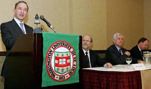 Chancellor Mark S. Wrighton announces the formation of the McDonnell International Scholars Academy Oct. 19 at the Overseas Press Club in New York City. Looking on are (from left) John F. McDonnell, vice chairman of the Washington University Board of Trustees; John C. Danforth, chair of the McDonnell International Scholars Academy External Advisory Committee; and Donald B. McNaughton, senior vice president, international and strategic ventures, Corning Inc.