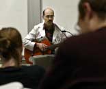 Perry sings for his students about Parkinson's disease to the tune of