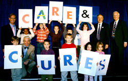 Joe Buck, Jonathan Gitlin, Lee Fetter and Larry Shapiro (L-R) join a group of children to launch the Children's Discovery Institute.