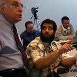 Ibrahim Al Hoqail (right), dean of the medical college at King Fahad Medical City, asks a question of instructor Stuart Boxerman (left), in statistics class at the Washington University School of Medicine.