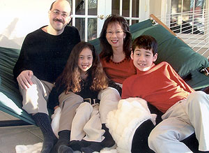 Arie Perry, daughter, Jaclyn, 10, wife, Zenobia, and son, Ryan, 13, relax at their Chesterfield home.