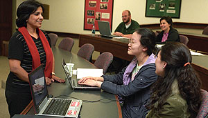 Radhika Regmi Pokharel (left), coordinator and trainer for the Community Mediation Program of the U.N. Development Program's Mainstreaming Gender Equity Programme in Kathmandu, meets with students during a recent alternative dispute-resolution class.