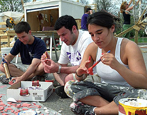 (From left) Seniors Ross Demain, Eli Zimerman and Adi Noiman work on decorations to be used for Thurtene Carnival.