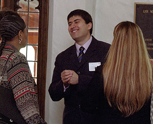 Jorge Marcos enjoys a laugh with well-wishers at The Women's Society of Washington University's April 19 meeting. Marcos, who has been studying at St. Louis Community College-Meramec and carries a 4.0 GPA in addition to his work and volunteer activities, received a 2006-07 full-tuition scholarship from the society.