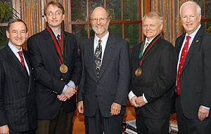 (From left) Chancellor Mark S. Wrighton; Clay F. Semenkovich, M.D., professor of cell biology and physiology and of medicine and director of the Division of Endocrinology, Metabolism and Lipid Research; John F. McDonnell, vice chairman of the Board of Trustees; Gary D. Stormo, Ph.D., professor of genetics; and Larry J. Shapiro, M.D., executive vice chancellor for medical affairs and dean of the School of Medicine, mark the installation earlier this month of Semenkovich and Stormo as the Gasser and Erlanger professors, respectively. The professorships are named for Joseph Erlanger and Herbert Gasser, two former faculty members who were awarded the Nobel Prize in physiology or medicine in 1944.