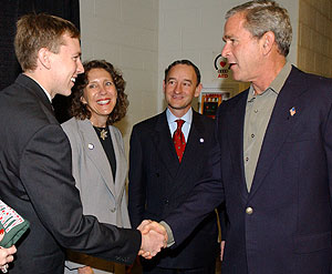 Ader welcomes President George W. Bush to the University Oct. 8, 2004, for the second presidential debate of that campaign. Looking on are Chancellor Mark S. Wrighton and his wife, Risa Zwerling Wrighton.